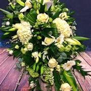 White and green casket top